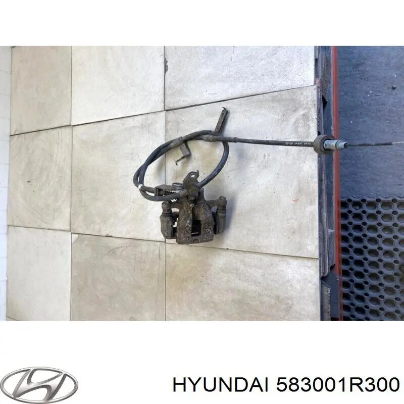 583001R300 Hyundai/Kia pinza de freno trasera izquierda