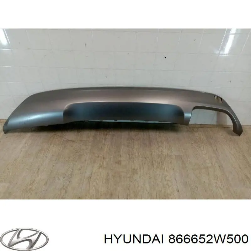 866652W500 Hyundai/Kia cubierta, parachoques trasero