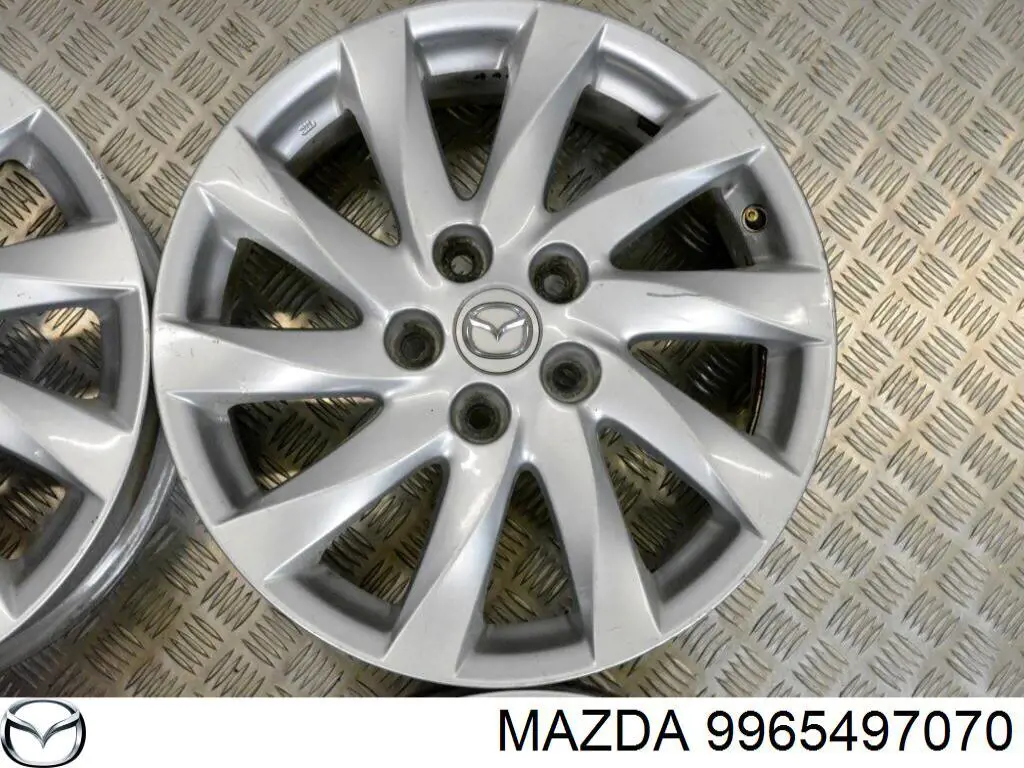 9965497070 Mazda Aros