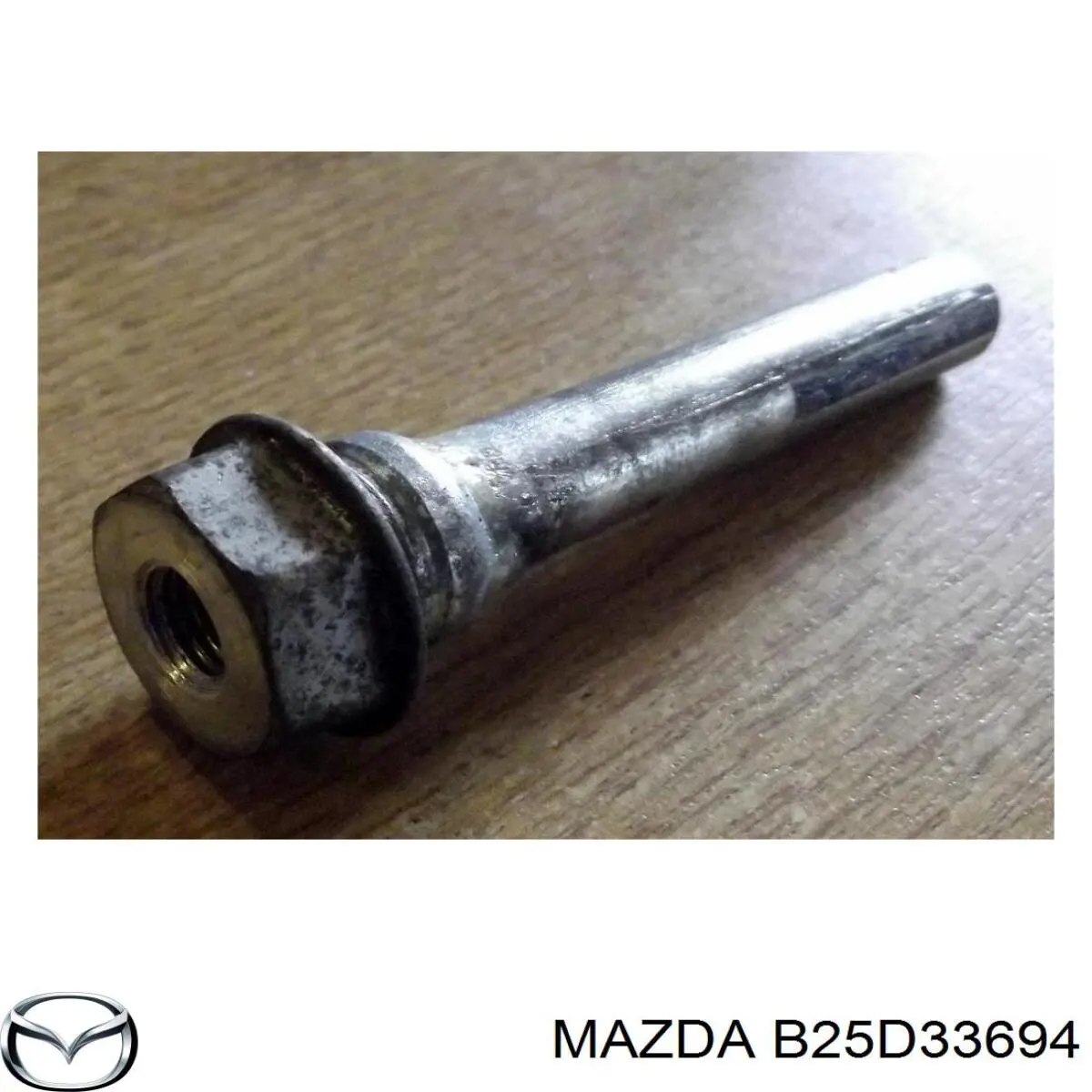 Guía de la pinza de freno delantera Mazda B25D33694