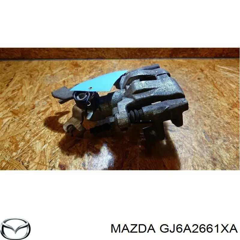 GJ6A2661XA Mazda pinza de freno trasero derecho
