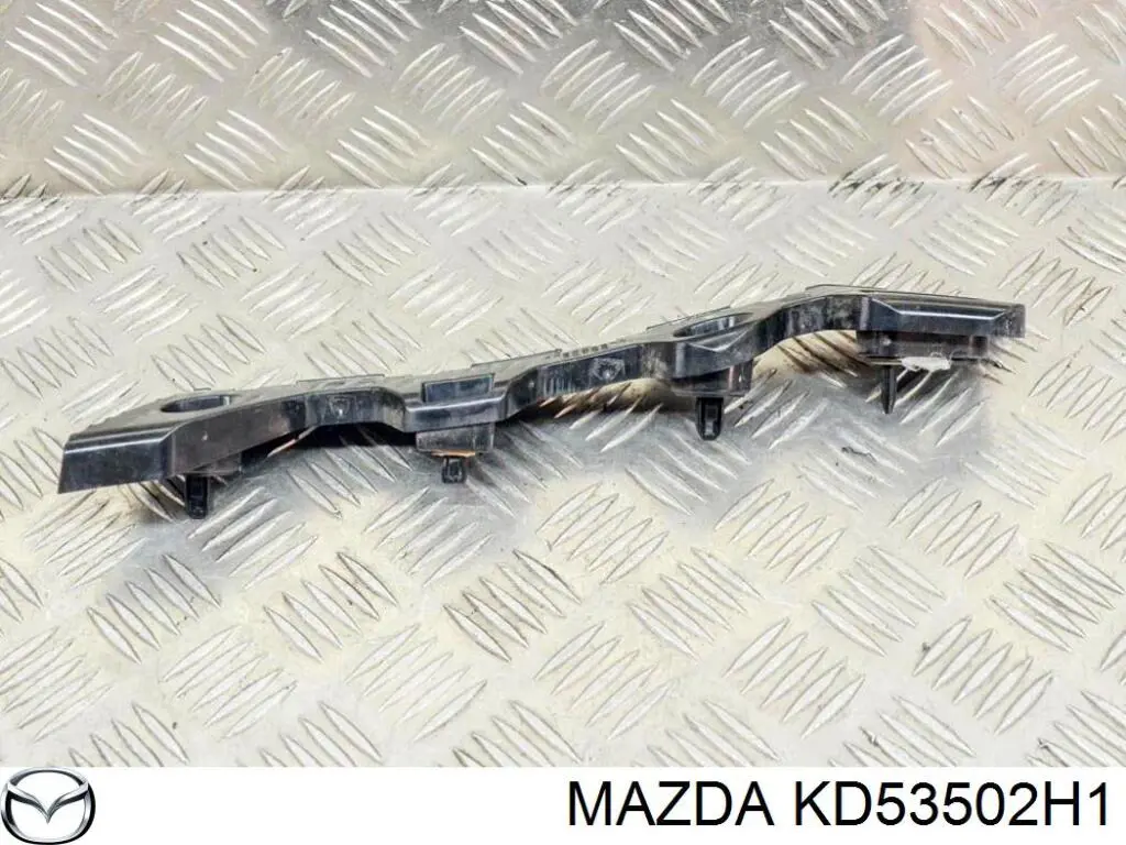 Soporte exterior derecho del parachoques trasero KD53502H1 Mazda