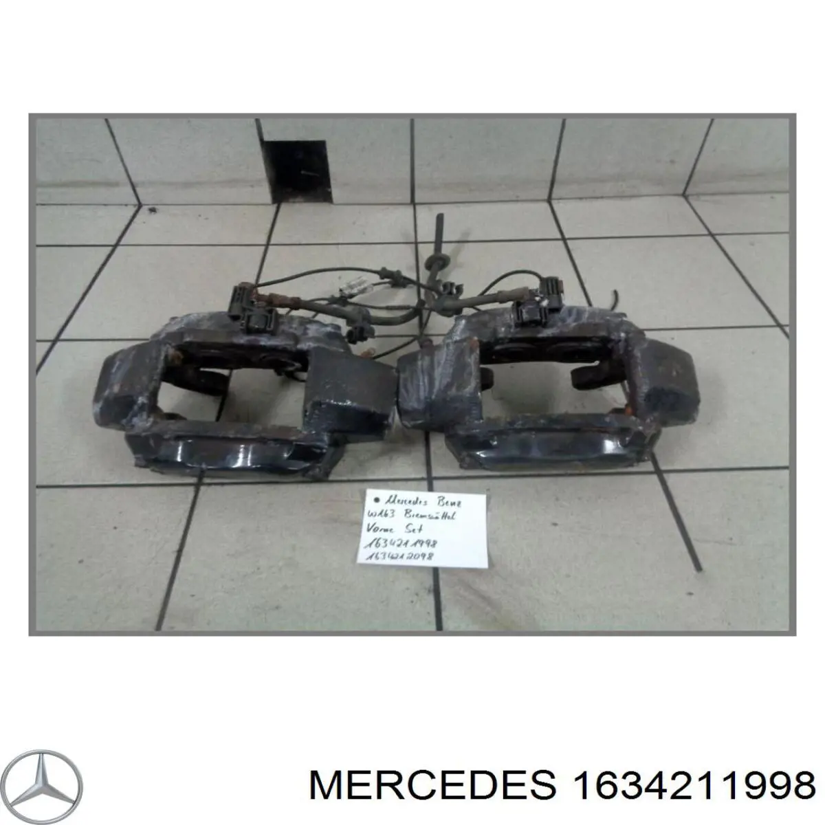 1634211998 Mercedes pinza de freno delantera izquierda