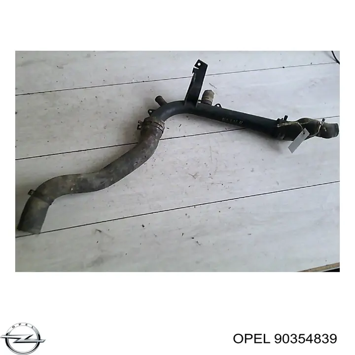 90354839 Opel brida del sistema de refrigeración (triple)