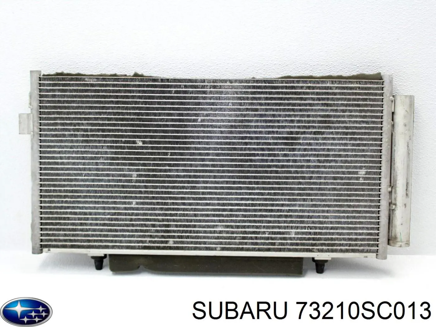 73210SC013 Subaru condensador aire acondicionado