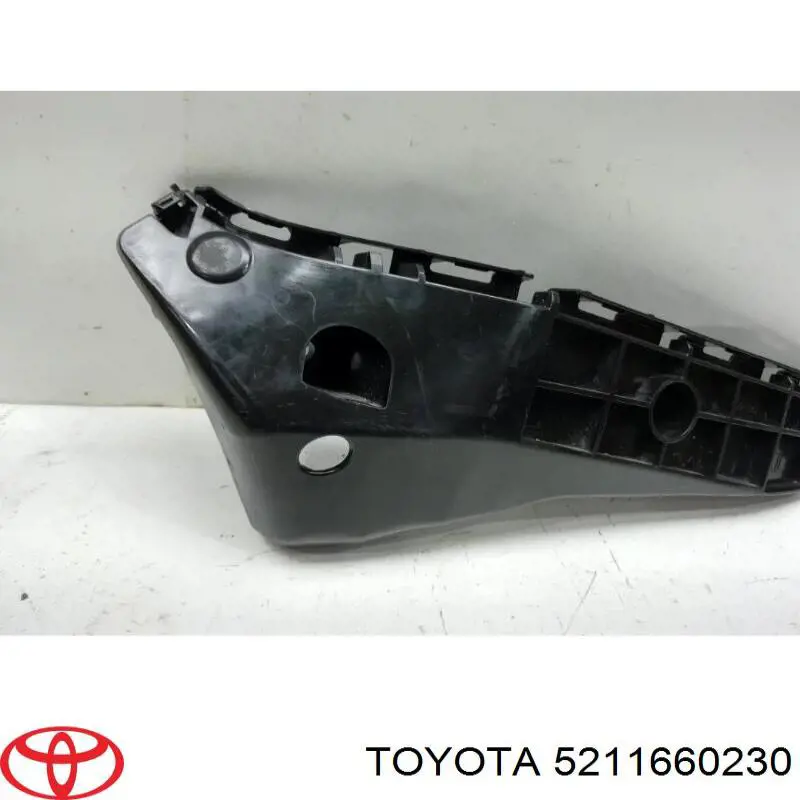 5211660230 Toyota Soporte exterior izquierdo del parachoques delantero