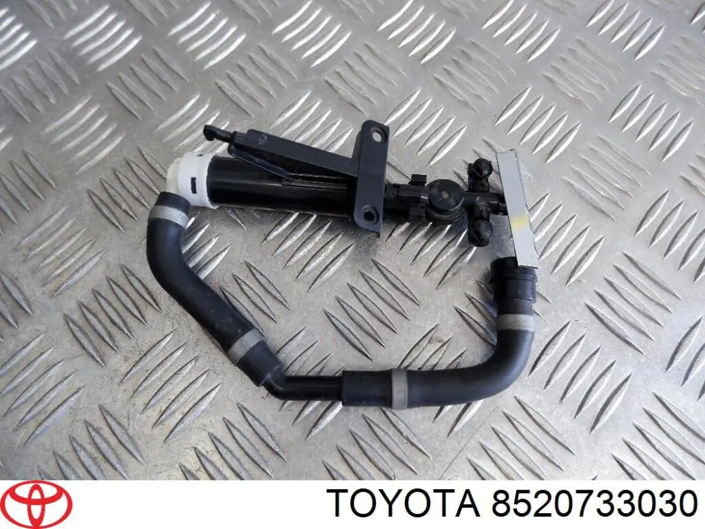 8520733030 Toyota soporte boquilla lavafaros cilindro (cilindro levantamiento)