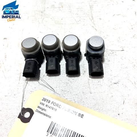 Sensor De Alarma De Estacionamiento(packtronic) Delantero/Trasero Central EM2Z15K859AA Ford