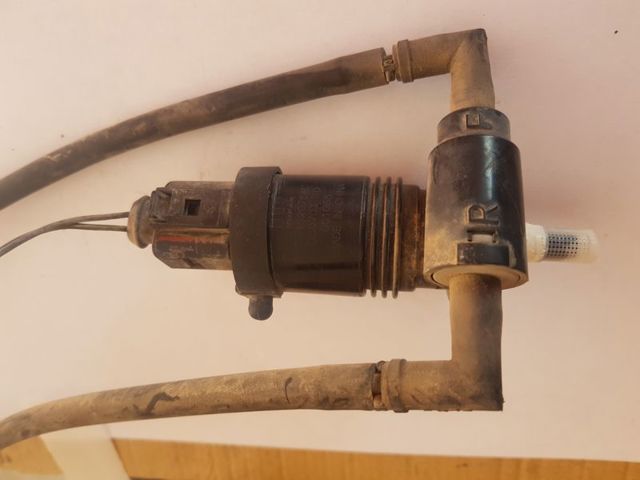Bomba de agua limpiaparabrisas, delantera 05152075AC CHRYSLER