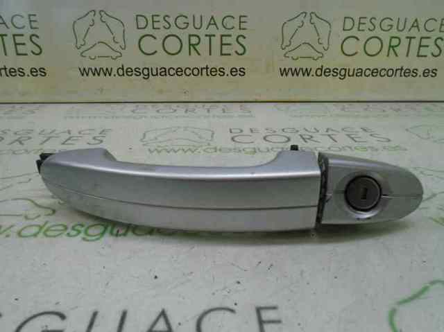 Tirador de puerta exterior delantero izquierda 1437721 Ford