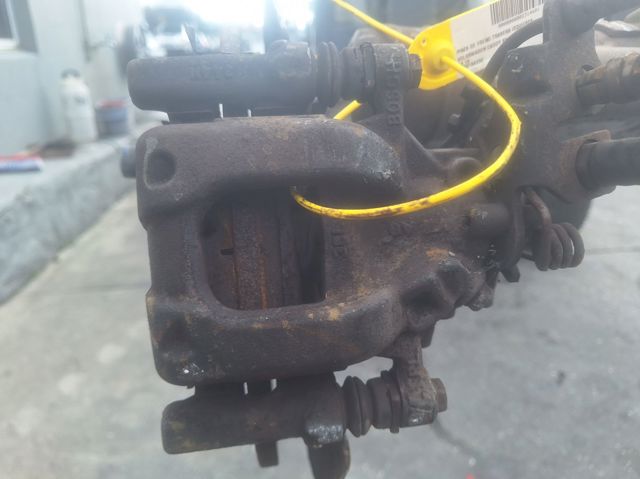 Pinza de freno trasera izquierda 2K0615423C VAG