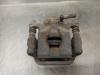 Pinza de freno trasero derecho 440011KD0A NISSAN