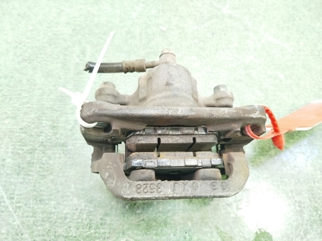 440011KD0A NISSAN Pinza de freno trasera derecha  en stock Huelva