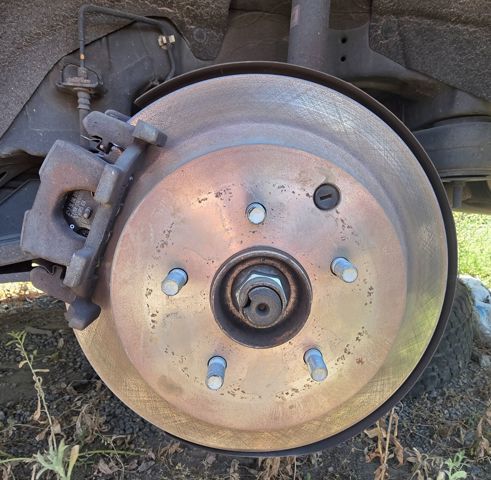 Pinza de freno trasera izquierda 440111AA0A NISSAN