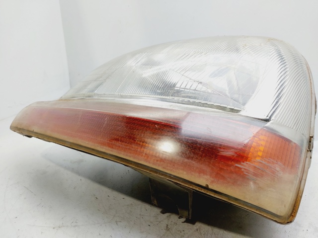 7701044037 Faro izquierdo  en stock Castellón
