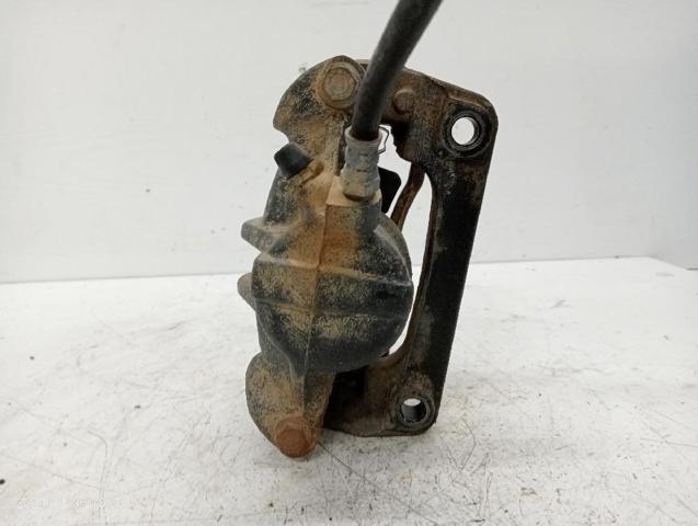 7701207786 RENAULT Pinza de freno delantera izquierda  en stock Gandía