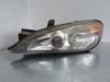 Faros delantero izquierdo 89003044 NISSAN