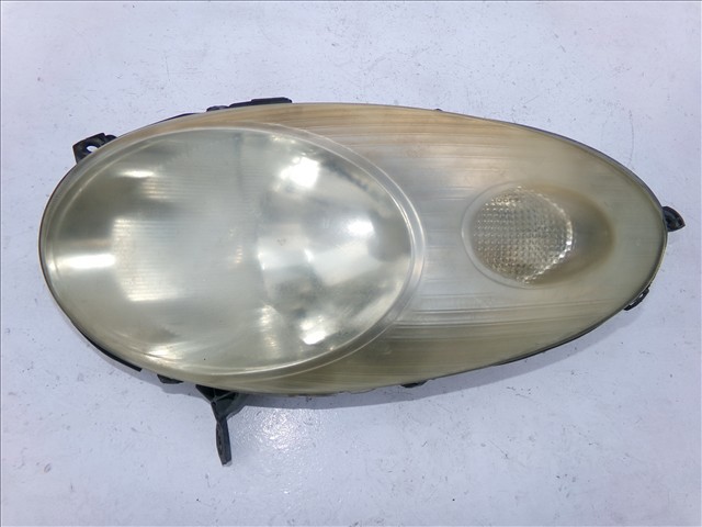 Faros delantero izquierdo 89007101 NISSAN