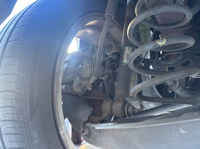 Pinza de freno trasera izquierda B4Y72699ZD MAZDA