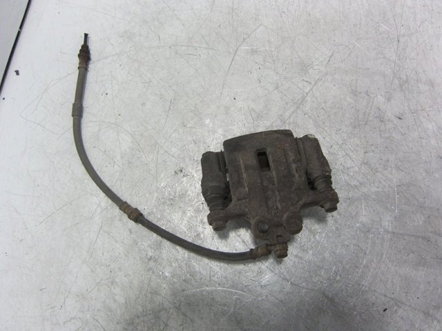 Pinza de freno trasero derecho L23226980G Mazda