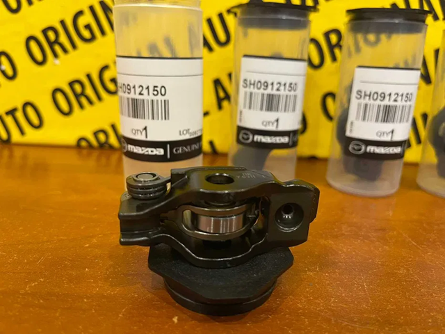SH0112150A Mazda palanca oscilante, distribución del motor, lado de escape