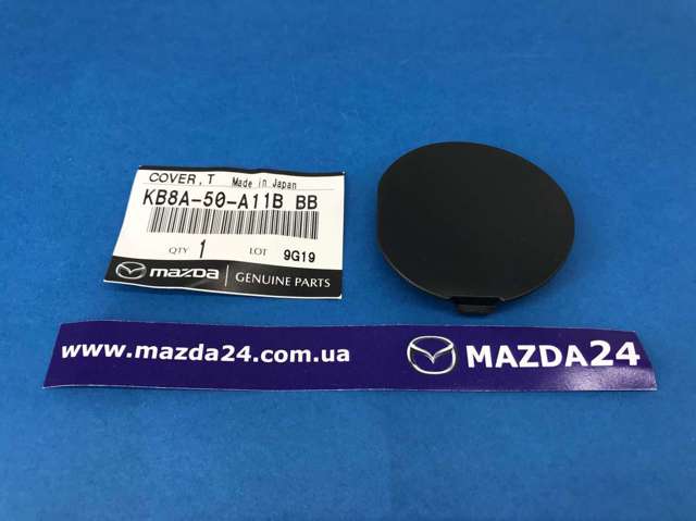 KB8A50A11BBB Mazda cobertura de parachoques, enganche de remolque, delantera