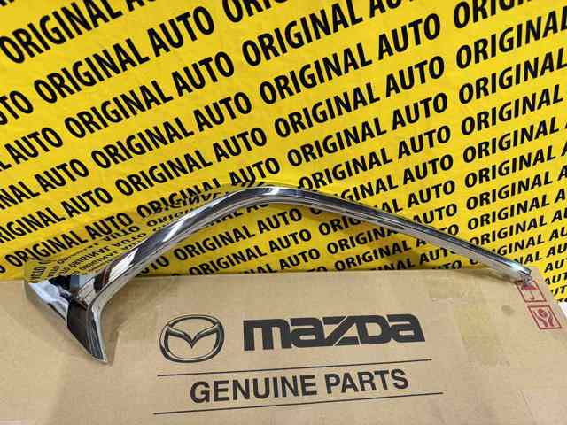 D10J507K0C Mazda Embellecedor izquierdo del parachoques delantero