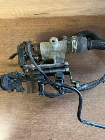 1S7G8K556AJ Ford Brida del sistema de refrigeración (triple unión)