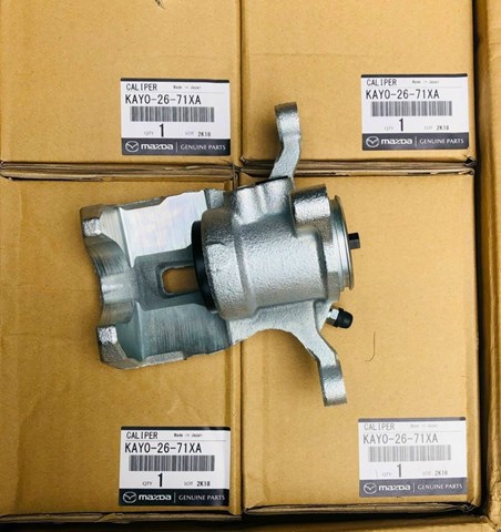 KAY02671XA Mazda Pinza de freno trasera izquierda